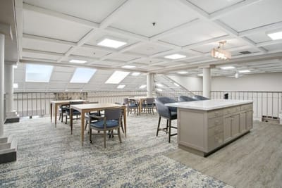 Bright, spacious interior with tables and chairs.