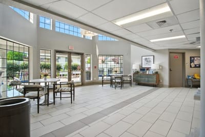 Bright common area with seating and outdoor view