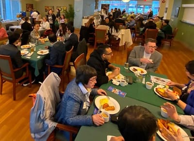 Residents dining together in a communal space