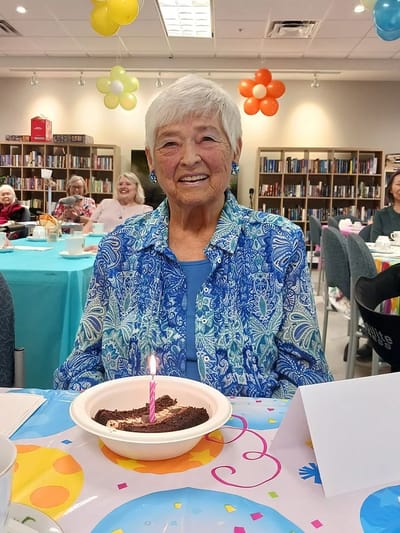 Resident celebrating with birthday cake