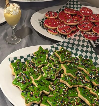 Colorful holiday cookies and dessert display.