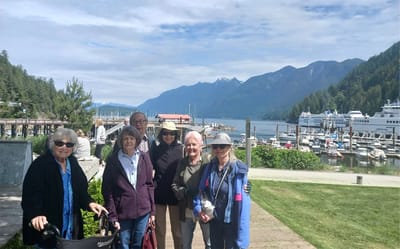 Group of residents enjoying an outdoor area by the water.
