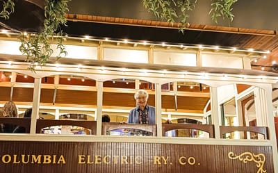 Resident enjoying a vibrant interior space with lights.