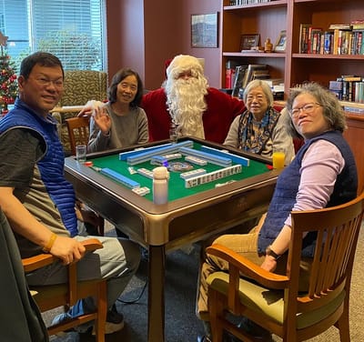 Residents and staff enjoying a festive gathering with Santa.