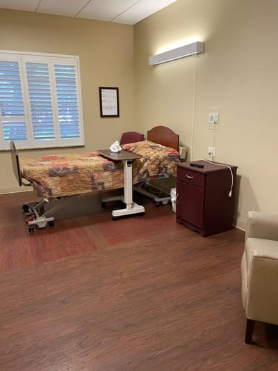 Interior of a private resident room with a bed and furniture