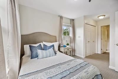 Cozy private bedroom with a neatly made bed