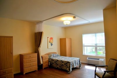 A private resident room equipped with furniture