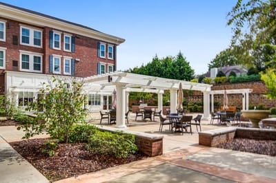 Outdoor seating area with pergola and landscape