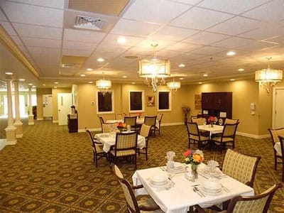 Dining area with tables set for residents