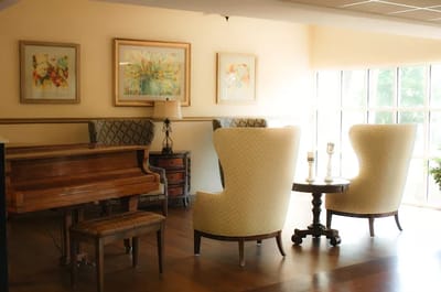 Cozy lounge area with seating and piano