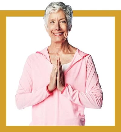 Smiling senior woman with hands in prayer position
