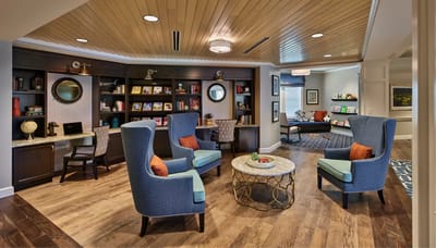 Common area with seating and bookshelves