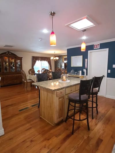 Bright common area with kitchen and seating