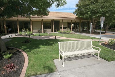 Outdoor seating area with well-maintained landscaping