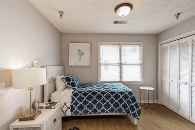 A well-furnished private resident room with natural light