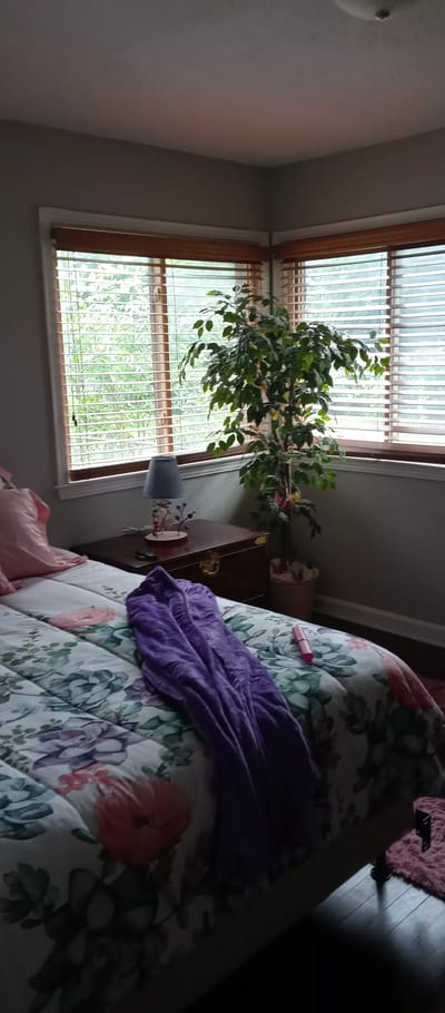 Cozy resident bedroom with floral decor and natural light