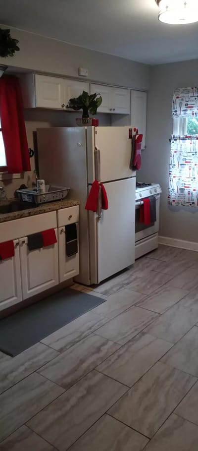 Bright kitchen area with appliances and decorations