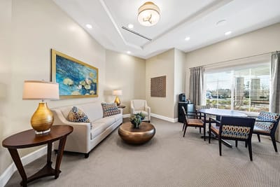 Bright interior lounge area with seating and artwork