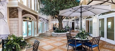 Indoor courtyard with seating and greenery