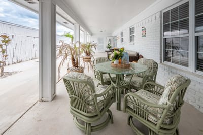 Outdoor seating area with tables and chairs