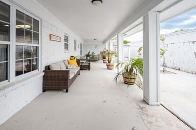Shaded outdoor seating area with plants
