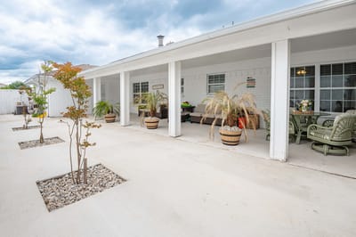 Outdoor patio area with seating and plants