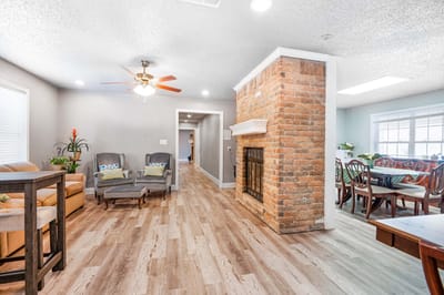 Bright common area with seating and dining space