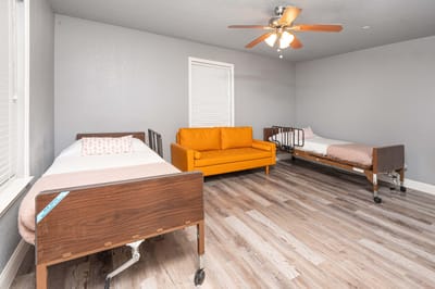 Interior room with two beds and a couch