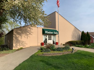 Front entrance of Windsor Oaks facility with landscaping
