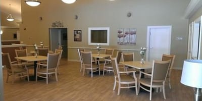 Bright dining area with tables and chairs