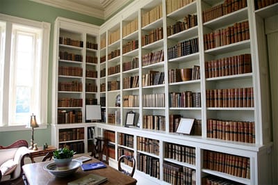 A cozy library filled with books and natural light