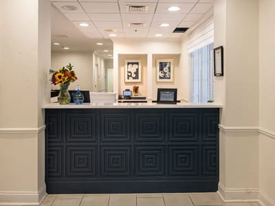 Reception area with flowers and awards displayed