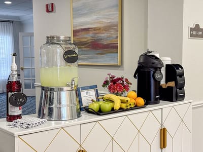Beverage station with lemonade, coffee, and fruit