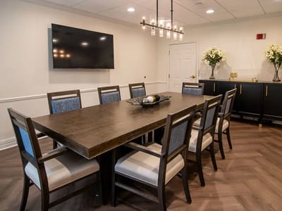 Bright dining room with a large table and modern decor