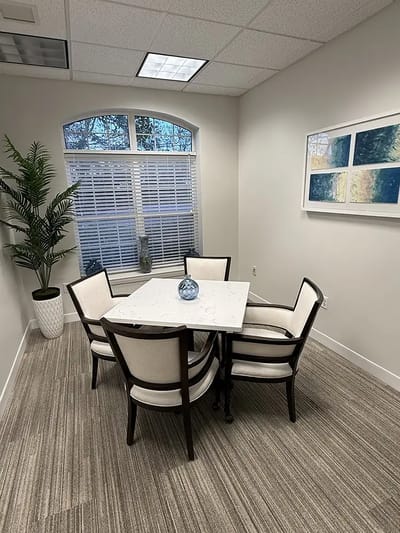 Bright interior room with a table and chairs