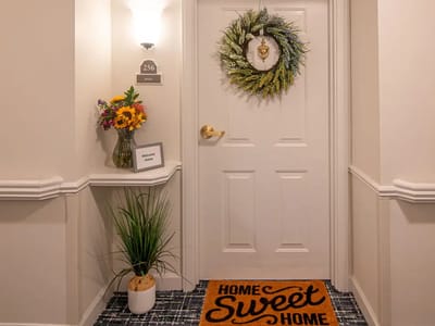Welcoming entrance to a resident's room with decor
