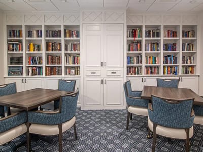 Cozy reading area with bookshelves and tables
