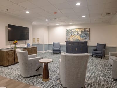 Bright common area with seating and artwork