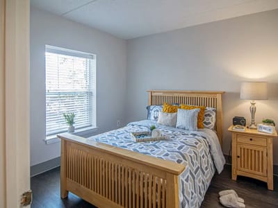 Cozy private resident room with a bed and window