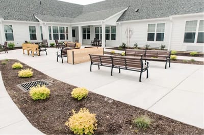 Outdoor patio area with benches and plants
