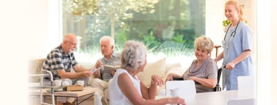 Residents interacting in a bright common area