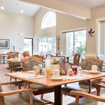 Dining area set for residents with drinks and decor