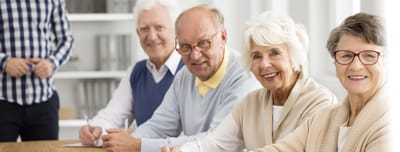 Residents engaged in an activity at a table