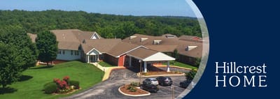 Aerial view of Hillcrest Home facility with logo