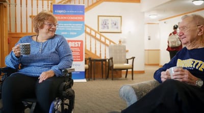 Residents enjoying tea in a cozy common area