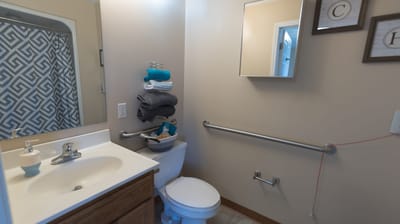 Bathroom interior with toiletries and towels