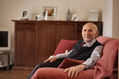 Elderly man relaxing in a comfortable living room setting
