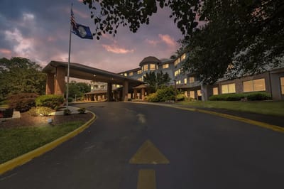 Exterior view of the facility entrance during sunset