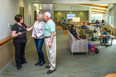 Residents and staff interacting in a communal area