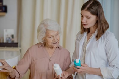 Senior resident discussing care products with staff